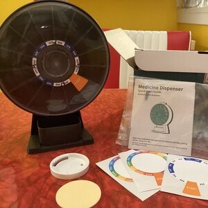 Black Medicine Dispenser with Colorful Labels